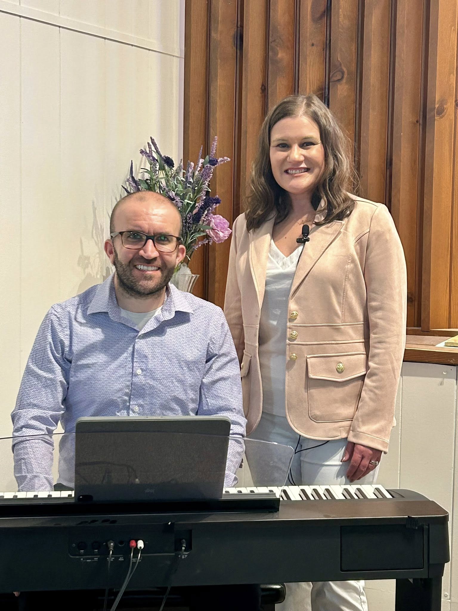 Devin Frank and Kendra German together at a formal indoor keyboard setup